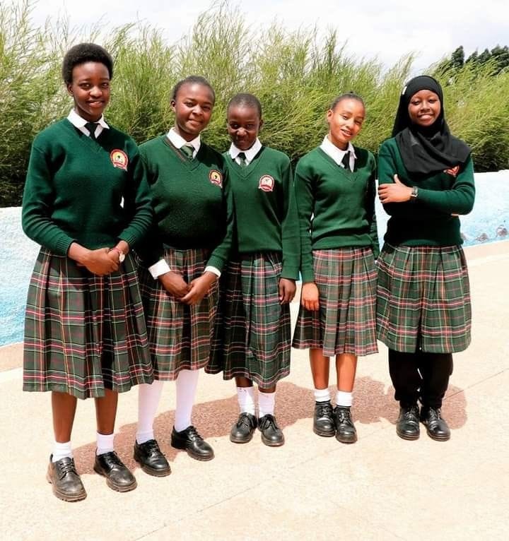 Girls in green school sweaters